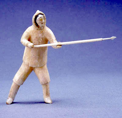 Sculpture of a standing hunter with a harpoon