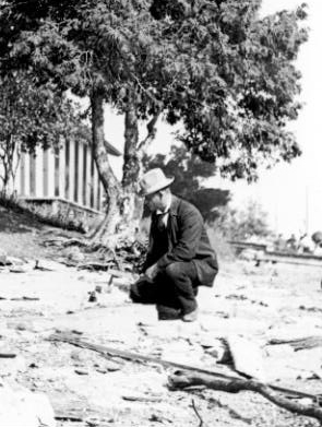 T.W. Edwin Sowter examining limestone formation bedrock at Queen's Park, Aylmer, Québec