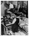 Applying postage to parcels, Eaton's, 
winter 1943.