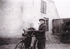 Sigvard Bennetzen (left) and a pipe-smoking, 14-year-old Chris Bennedsen, ca 1944