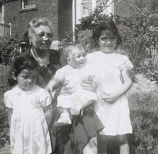 Carmela Colangelo and her granddaughters, Carmela, Theresa, and Paula Cavalluzzo, in Carmela’s backyard