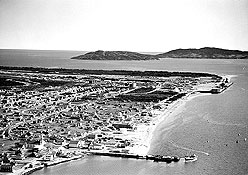 Aerial view of Sept-les with newly constructed railway and dock areas, 1953
