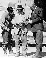 Jules Timmins in his Tyrolean hat, with son Bobby and General Manager William Durrell Iron Ore Company of Canada