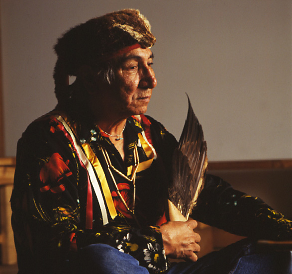 Aboriginal man seated and holding a bird's wing  Ottawa - Fred Cattroll (photographer)