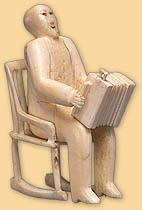 Man in Rocking Chair Playing Concertina