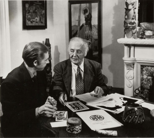 Marius Barbeau in the company of the artist Arthur Price (his son-in-law) discussing the illustrations for a future publication: 