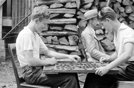 Two men playing chess behind sculptor Anger's workshop in Qubec City, Qubec, 1935., © CMC/MCC, Marius Barbeau, 2004-1364