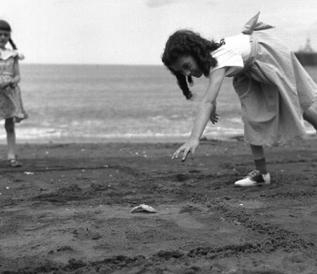 Yvette Larive, 10 years old, playing hopscotch on the beach with a starfish in Grande Valle, Gaspsie, Qubec, 1958., © CMC/MCC, Carmen Roy, J15080