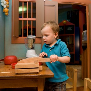 Child playing with hand toys
