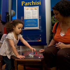 Visitors playing parchisi
