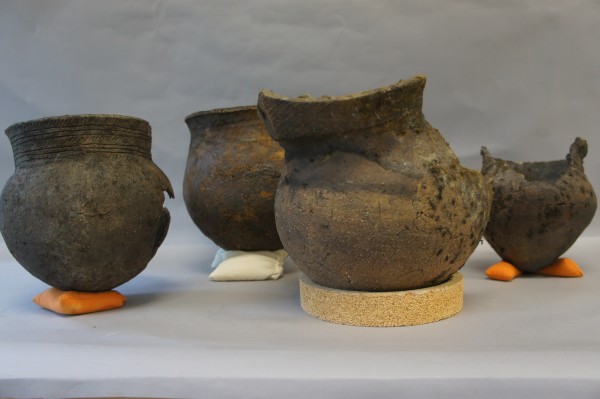 Four of the seven recently acquired Aboriginal pottery vessels found in the St. Lawrence River. Canadian Museum of History, Photo: E. Laberge