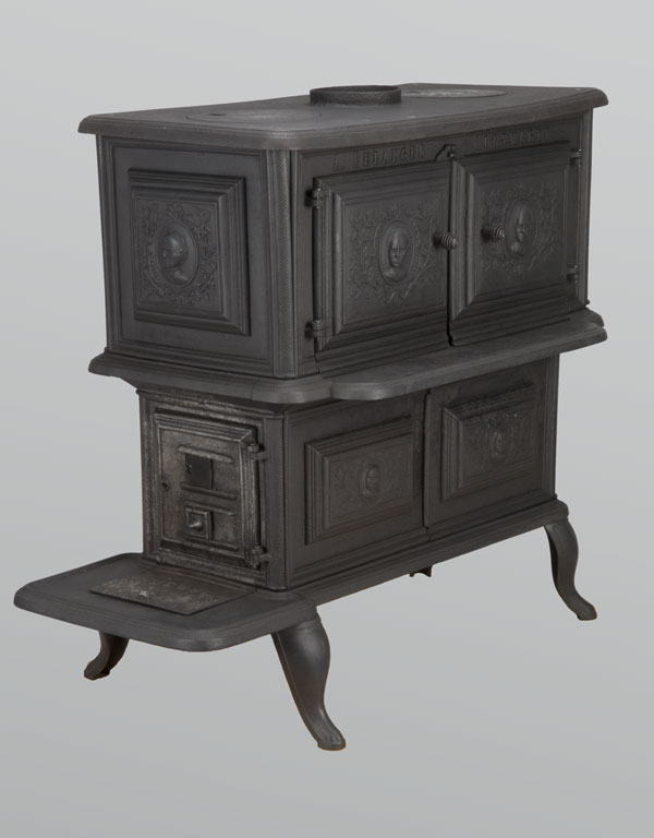Large two-tier cast iron stove decorated with medallions of Sir Wilfrid Laurier. Canadian Museum of History, A-4353