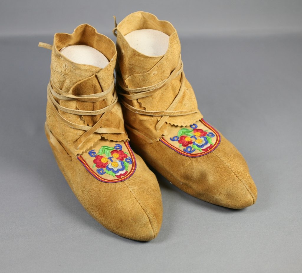 Woman’s moccasins, late 19th century, silk embroidery on caribou and moose hide, unidentified female Cree artisan, Norway House, Manitoba While other Manitoban women won the vote in 1916, the maker of these beautiful shoes would have been denied the vote in federal elections for another 44 years. Manitoba Museum, H4-0-779.