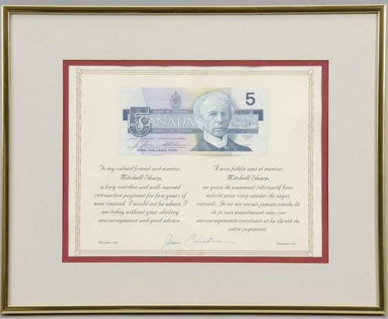 Framed five-dollar bill featuring Laurier, presented by Prime Minister Jean Chrétien to his advisor Mitchell Sharp to thank him for five years of volunteer service to the Cabinet, December 1999. Canadian Museum of History, 2005.32.67. Gift of Jeanne d’Arc Labrecque Sharp. IMG2008-0060-0085-Dm