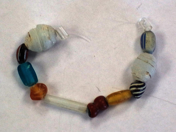 During the New France era, Aboriginal Peoples would trade fur for a variety of merchandise including European glass beads like these ones found on an archaeological site at Fort Frontenac. Photo: Andrew Wollin, BFC Kingston