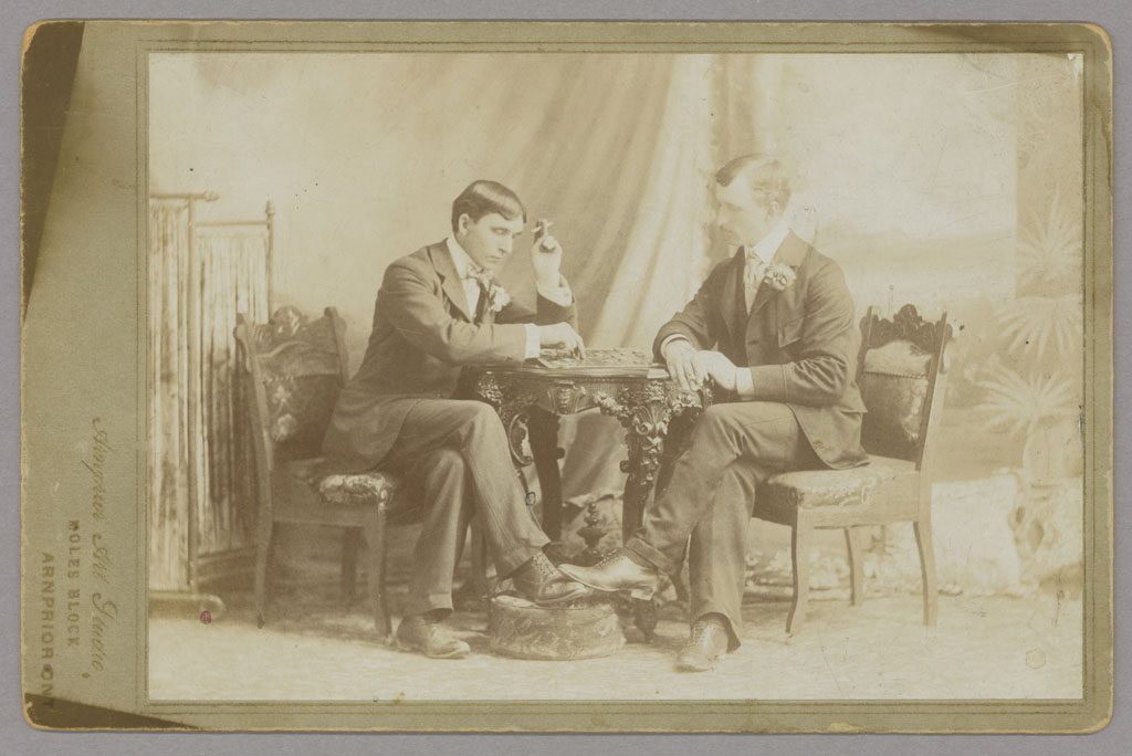 Two men playing checkers