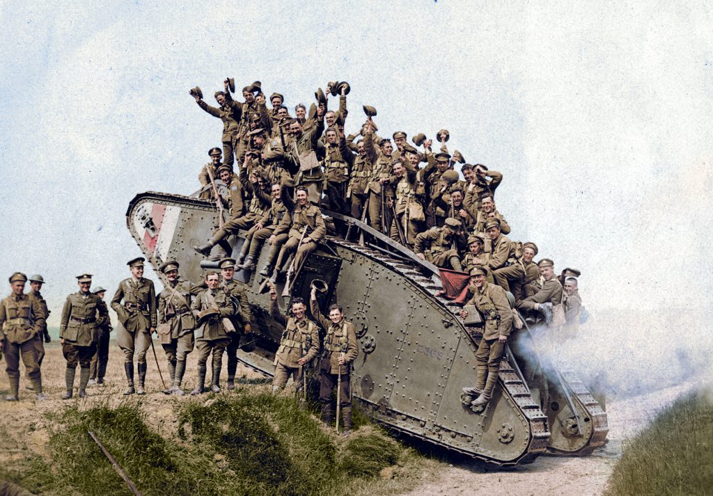 Colourized photo of troops crowded on a tank