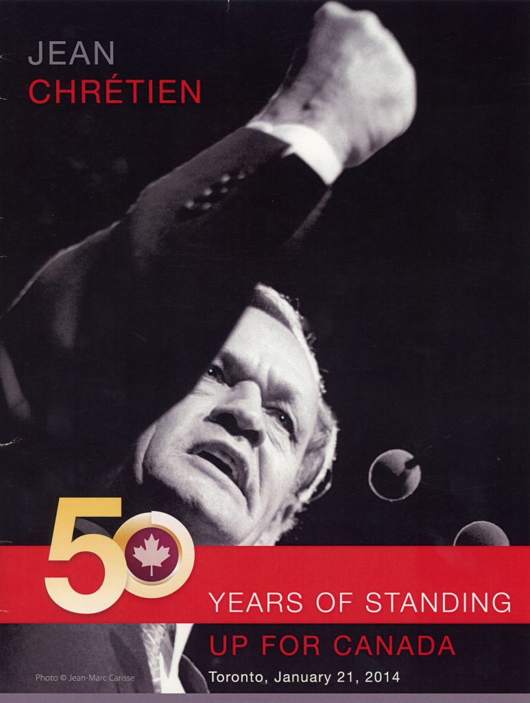 Jean Chrétien: 50 Years of Standing Up for Canada, booklet with a black and white image of Chrétien with a right fist up.