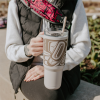 Insulated tumbler with indigenous whale design.