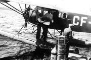 Mail and merchandise being loaded on board a Fairchild 71 for a rescue flight at Bear Lake, Alberta, July 6, 1935.