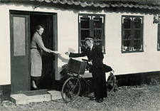 A rural postman delivering the mail on a Post Office 