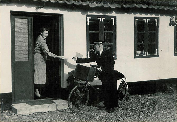 A rural postman delivering the mail on a Post Office bicycle