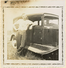 Chris Bennedsen with his first car, a 1931 Oldsmobile, Cobourg, Ontario, 1953. 