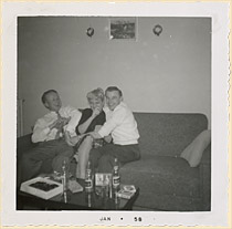 Erik Skov, Chris, and a friend at a Christmas party at Chris and Erik's Bloor Street West apartment, Toronto, 1957