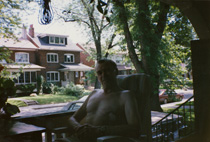 Chris on the porch of the home on Arlington Avenu