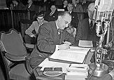 Joey Smallwood signs the Terms of Union, December 11, 1948