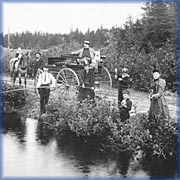 Family outing by a stream - 
Provincial Archives of New Brunswick
