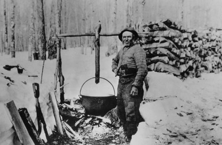 Vincent Lessard outside his sugarhouse boiling down the maple sap in iron cauldrons, Saint-Joachim de Montmorency, Québec, 1919., © CMC/MCC, J.G. Morel, 79220