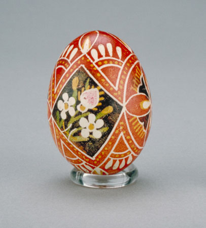 Decorated Easter egg decorated with black, yellow green and white geometrical and floral motifs., © CMC/MCC, 72-658.1