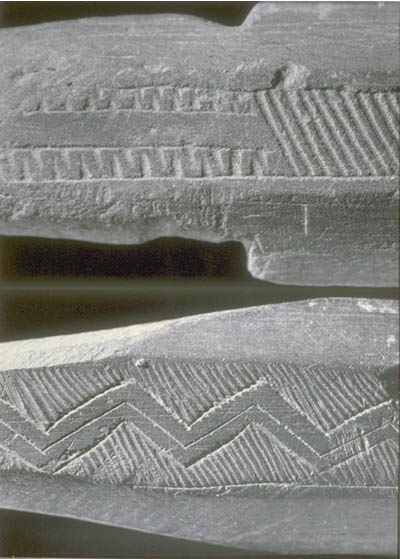 Decorations engraved on two stone bayonets.