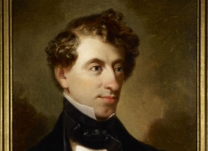 An archaeological portrait of a man with curly hair.
