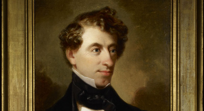 An archaeological portrait of a man with curly hair.