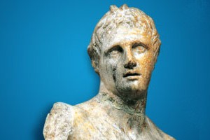 A bust of a roman statue on a blue background.