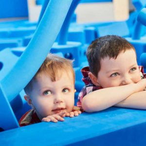 Children with big blue foam blocks