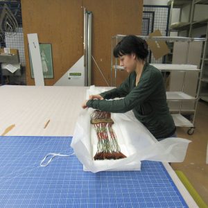 Karyne Belanger (Métis) packing a quilled bag in a storage mount