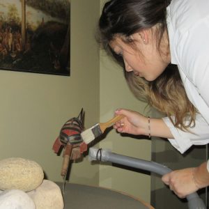 Lydia Mestokosho-Paradis (Innu) cleans a rattle.