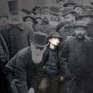 A man is standing in front of a crowd of people