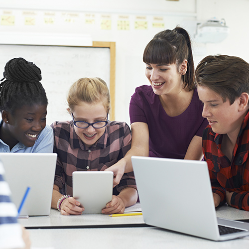 Teenage students with teacher