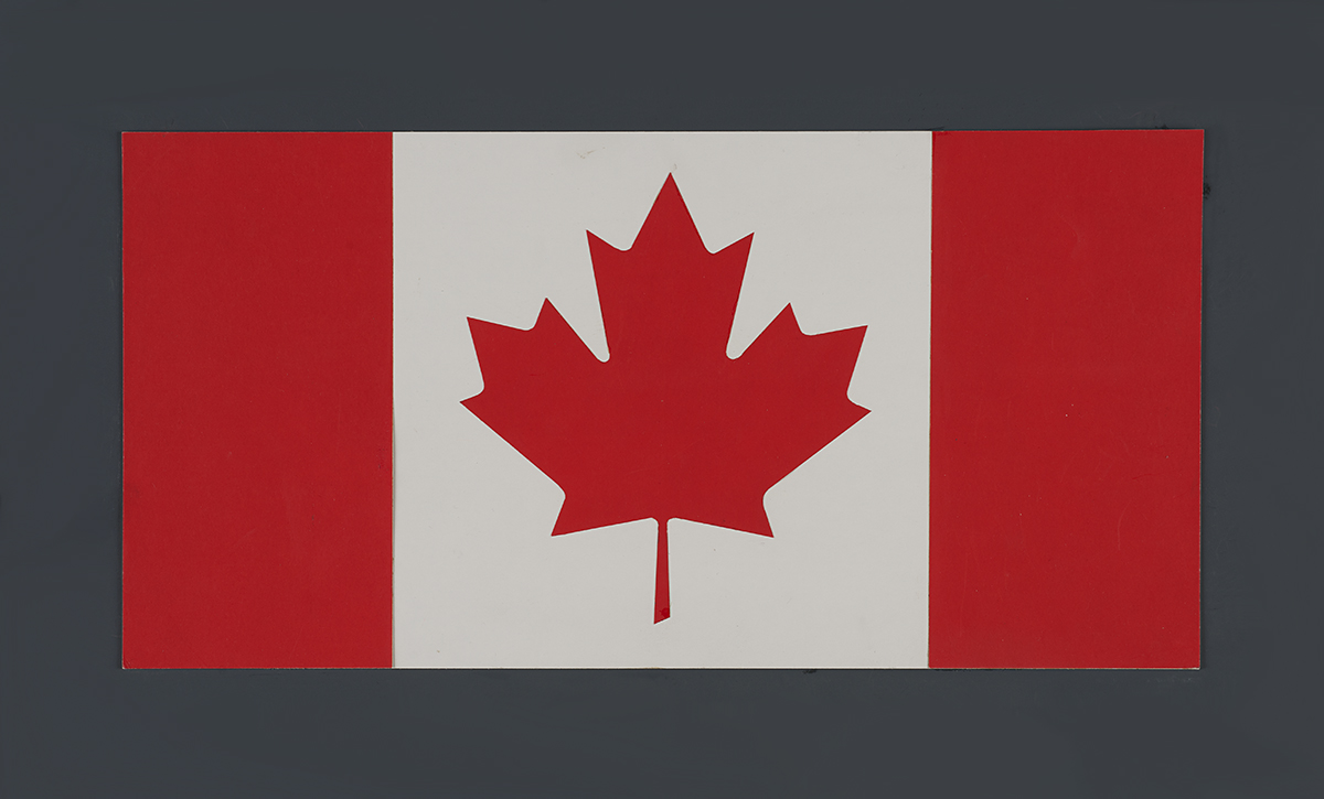 A red and white flag with a leaf on display at the Canadian Museum of History in Ottawa.