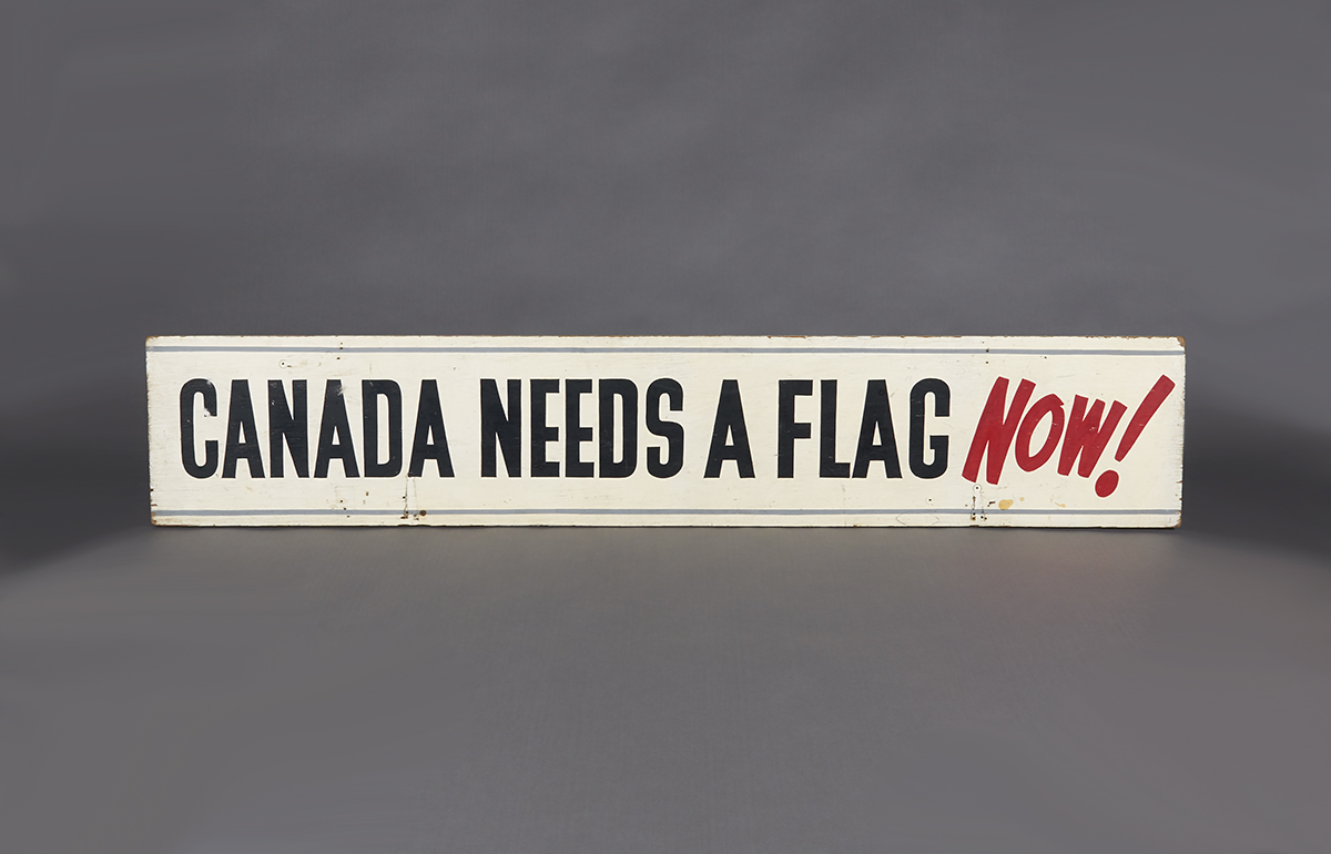 A white rectangular sign with black text in Ottawa.