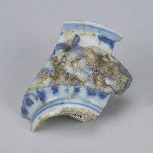 Fragment of a white porcelain bowl with blue designs