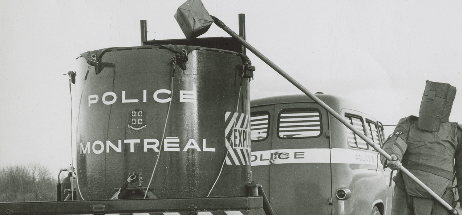 A police truck with a box on top, exhibited at the Canadian Museum of History in Ottawa.