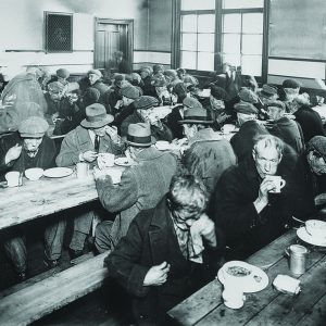 Men eating at a soup kitchen