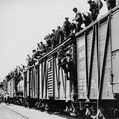 A group of people standing on top of a train in Ottawa at the Canadian Museum of History.