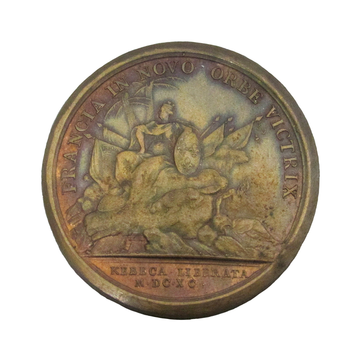 A bronze medal with an image of a woman riding a horse on display The Canadian Museum of History in Ottawa.