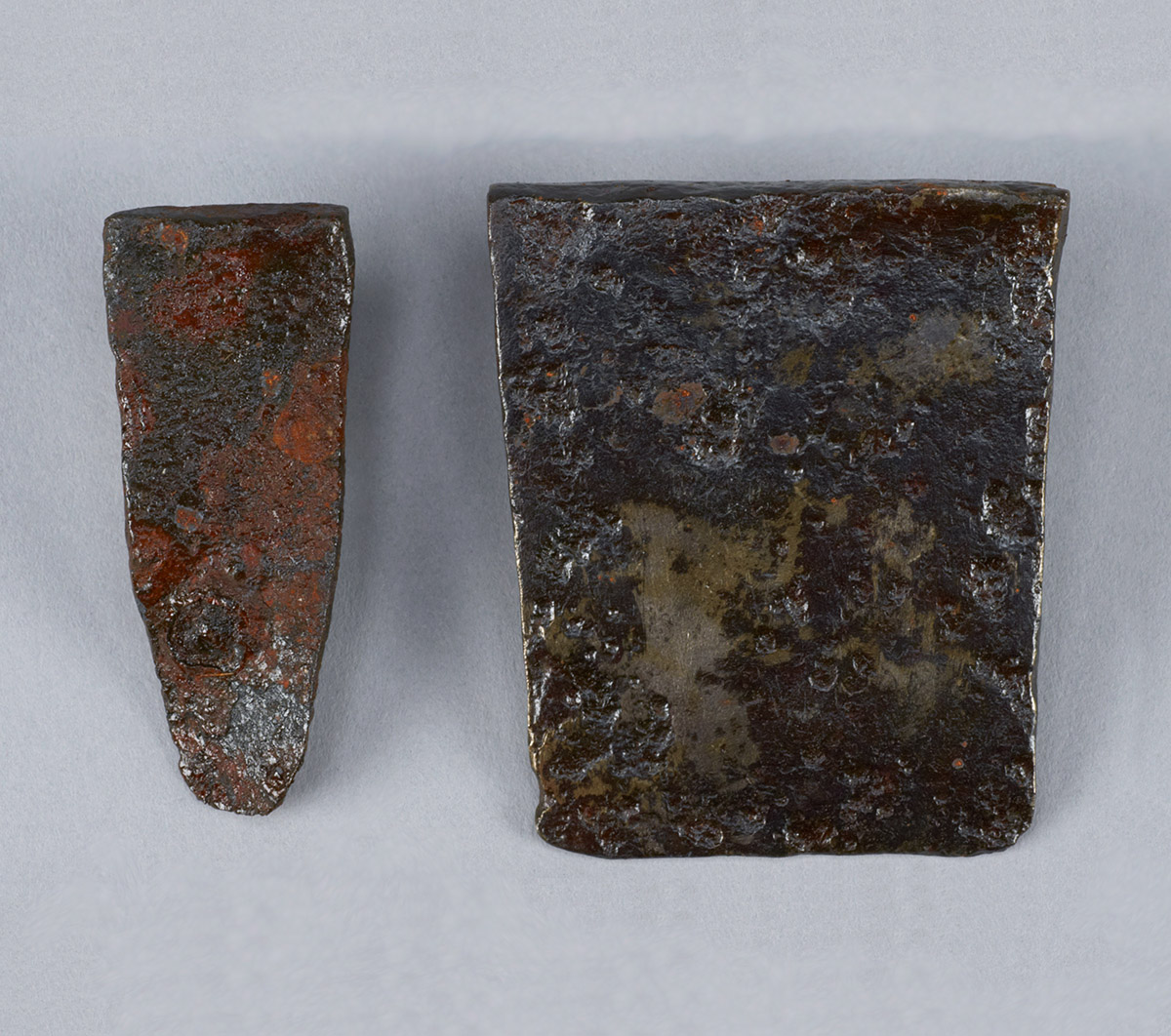 Two pieces of metal with rust on them exhibited in the Canadian Museum of History in Ottawa.